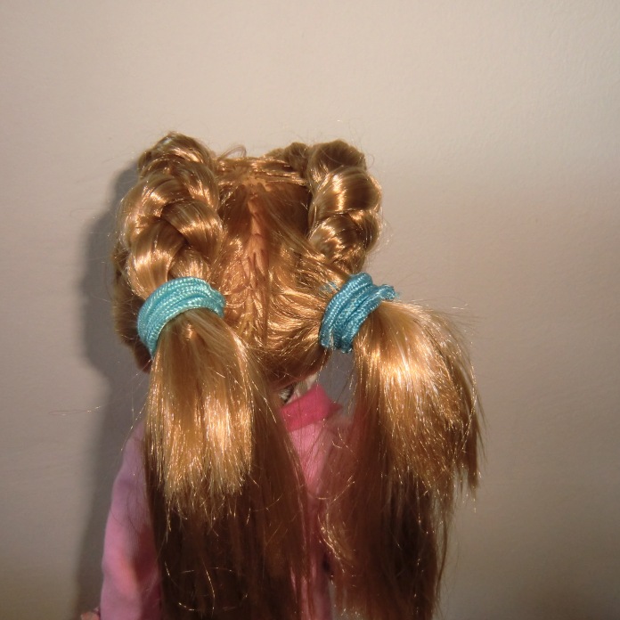 Two ponies/pigtails.